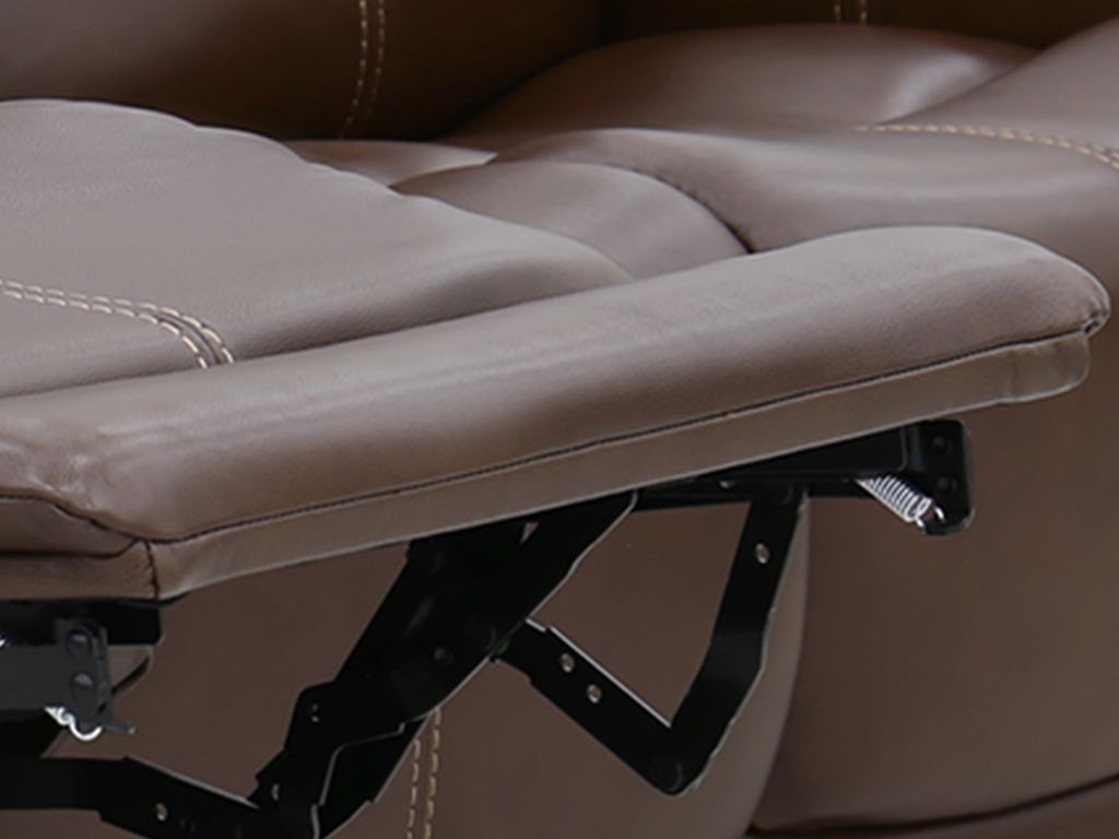 A brown leather reclining seat with its footrest fully raised, showing the steel mechanism beneath it.