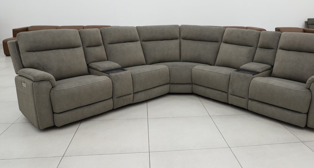Grey fabric power reclining sectional in an L-shape with storage consoles.