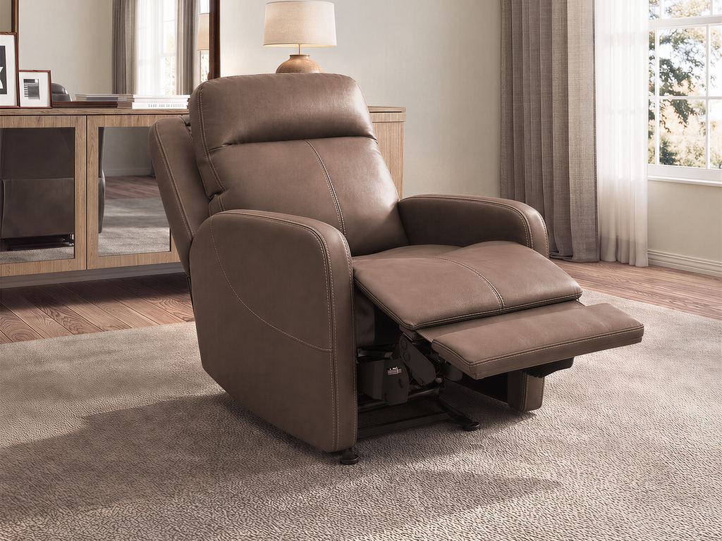 The taupe recliner reclined, with the footrest raised.